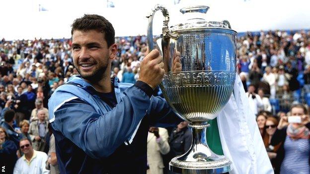 Grigor Dimitrov with the trophy at Queen's