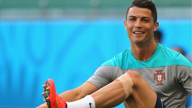 Cristiano Ronaldo smiles in training.