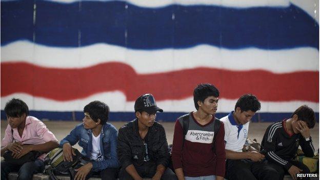 Cambodian migrant workers wait for their documents to be processed at the Aranyaprathet Police station as they prepare to migrate back to Cambodia on 15 June.