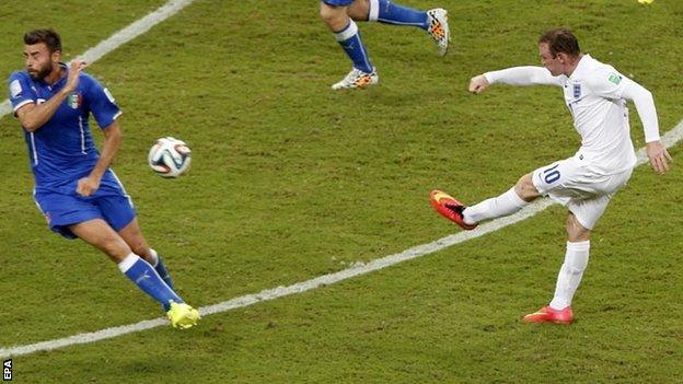 Wayne Rooney shoots from outside the box against Italy