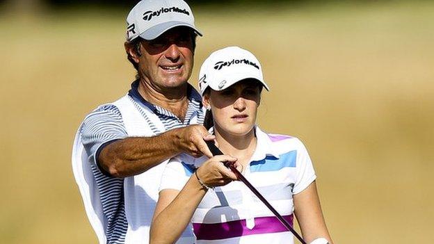 Lucy Williams receives instruction from her father David