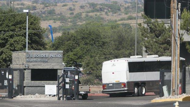 A bus enters the US Border Patrol facility in Nogales, Arizona.