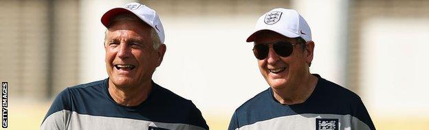 Sir Trevor Brooking & Roy Hodgson share a joke during an England training session