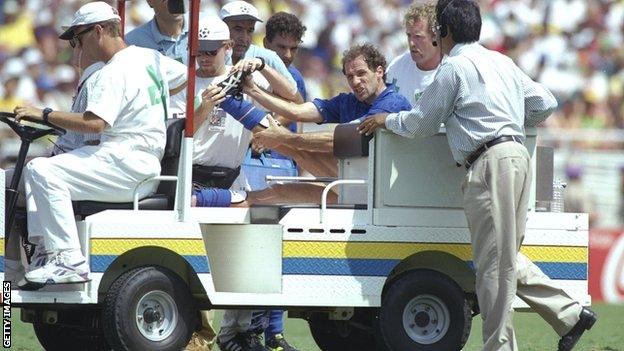 Franco Baresi is carried off on an electric cart