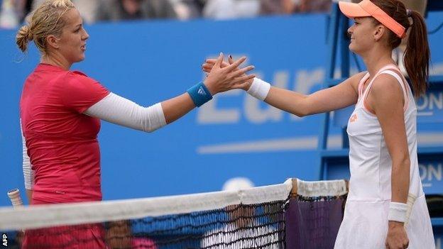 Anastasia Pavlyuchenkova shakes hands with Agnieszka Radwanska after winning their women's singles first round match at Eastbourne