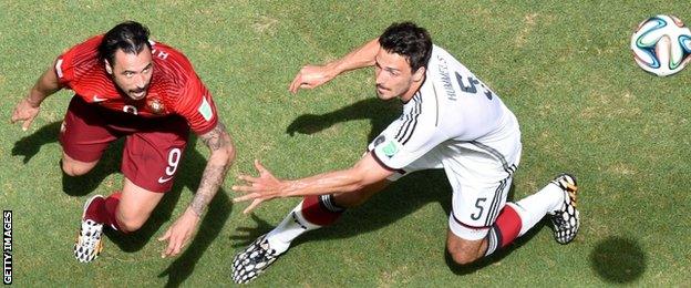 Germany defender Mats Hummels (right) is challenged by Portugal forward Hugo Almeida