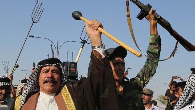 Shias chant slogans against ISIS in the north-western Baghdad suburb of Shula