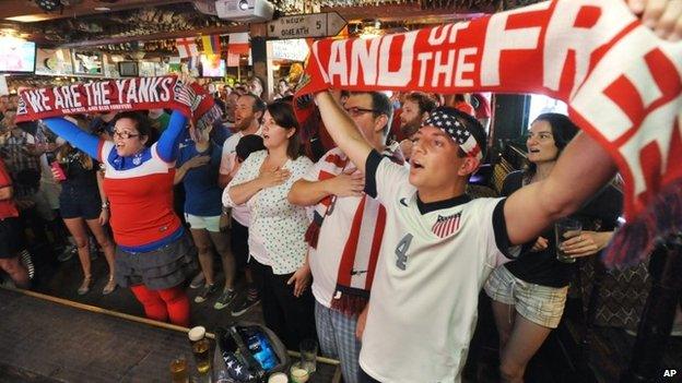 United States soccer fans sing the national anthem before the World Cup match against Ghana Lynch's Irish Pub in Jacksonville Beach, Florida 16 June 2014