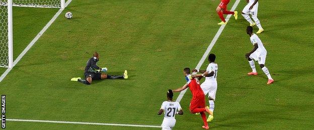 USA striker Clint Dempsey (centre) scores against Ghana in their Group G game