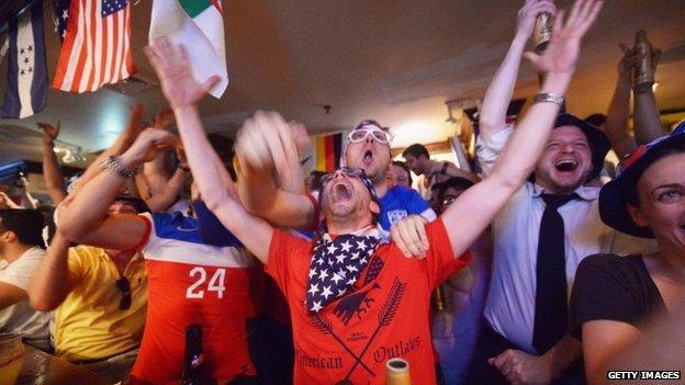 Soccer fans cheer for team US as they face Ghana during the World Cup in Brazil at Jack Dempsey's bar in New York City 16 June 2014