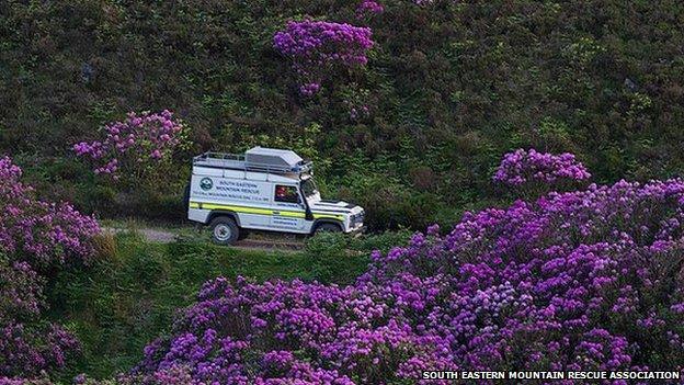 South Eastern Mountain Rescue Association vehicle in rhododendron forest