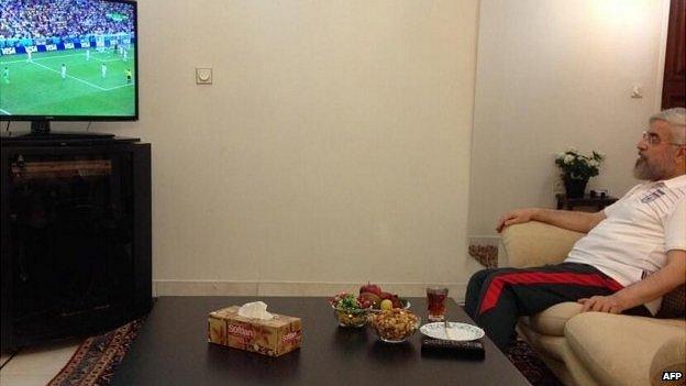 Iranian president Hassan Rouhani watching the country's football team play Nigeria in the 2014 World Cup