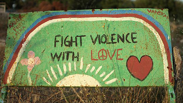 Sign with words 'Fight violence with love'