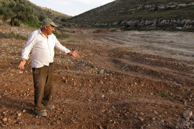 Daher Nassar standing where the orchard used to be