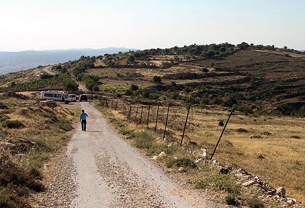 Vehicles parked where the road to the Tent of Nations farm is blocked