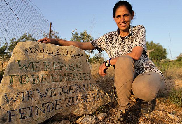 Sign with the words 'We refuse to be enemies'