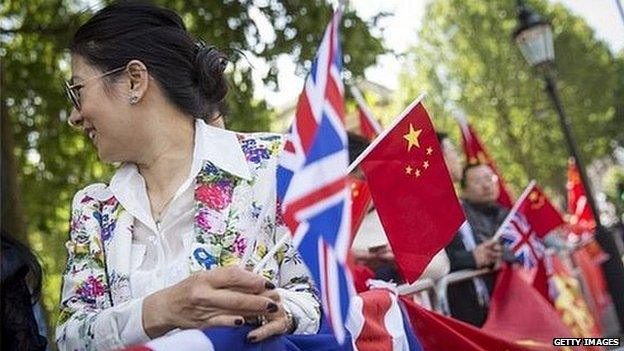 Supporters of Chinese Premier Li Keqiang gather opposite Downing Street