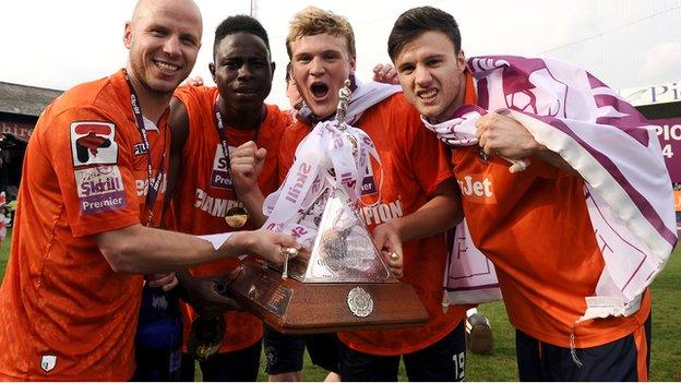 Luton players celebrate their return to the Football League