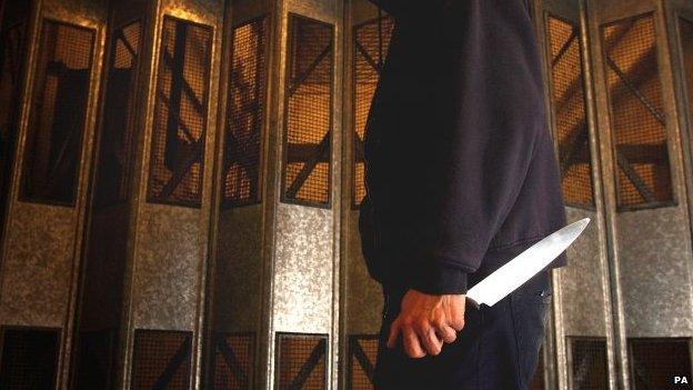 A man holding a knife