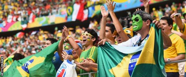 Brazilian fans cheer on their side during their World Cup group A match against Mexico