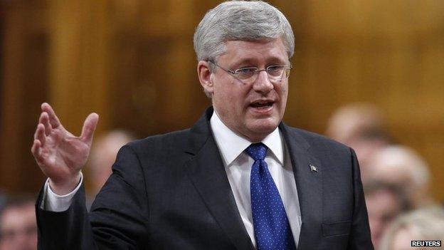 Canada's Prime Minister Stephen Harper speaks during Question Period in the House of Commons on Parliament Hill in Ottawa 11 June 2014