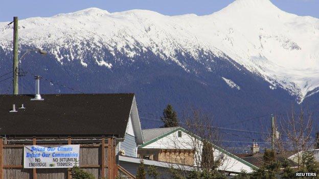 A Protest sign hangs from a building in the town of Kitimat, British Columbia 12 April 2014