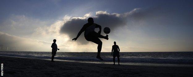 People playing football on the Copacabana beach in Rio de Janeiro