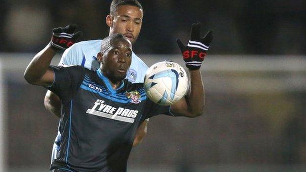 Stevenage's Lucas Akins controls the ball against Coventry