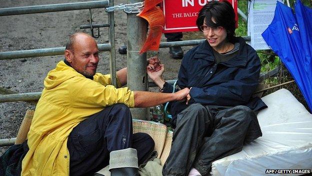 Natalie Hynde and her friend Simon Medhurst glue themselves together at Balcombe