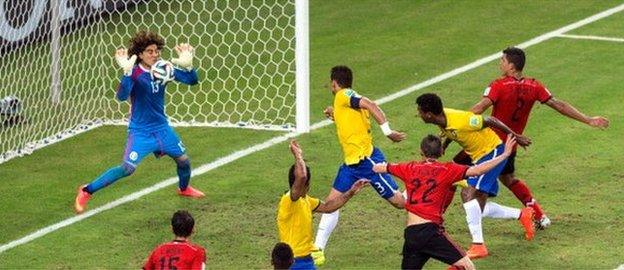 Brazil's Thiago Silva is denied by Mexico keeper Guillermo Ochoa