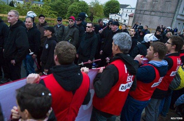 Protesters shout slogans at far right sympathisers marching in the north German town of Demmin, 8 May