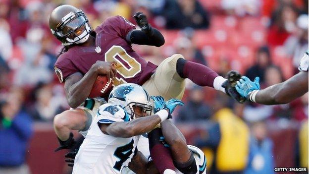 Quarterback Robert Griffin III of the Washington Redskins was tackled in Landover, Maryland, on 4 November 2012