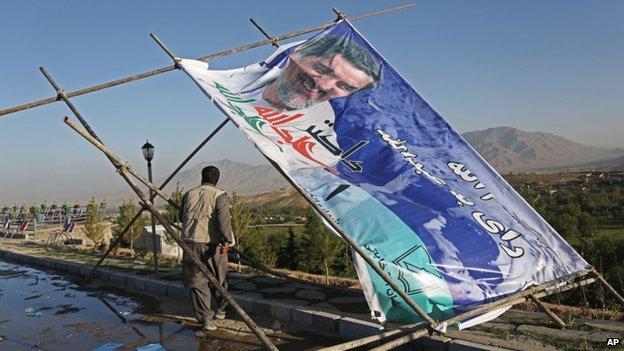 A man walks past a fallen election poster in Kabul. Photo: 9 June 2014