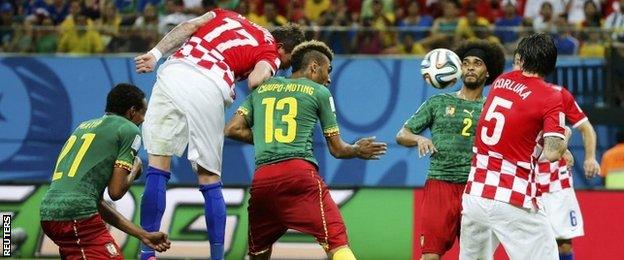 Croatia's Mario Mandzukic (second left) heads the ball