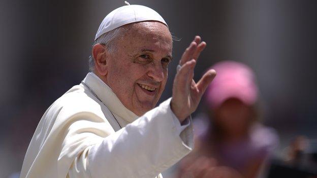 Pope Francis greets the crowd after his general audience at St Peter's square on 18 June, 2014 at the Vatican