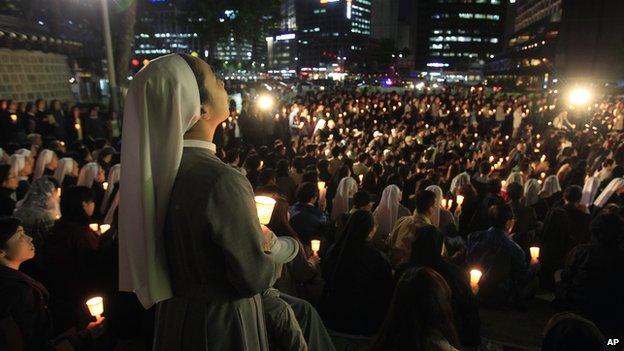 A Catholic nun participates in a service to pay tribute to the victims of the sunken ferry Sewol in Seoul, South Korea, on Wednesday, 30 April 2014