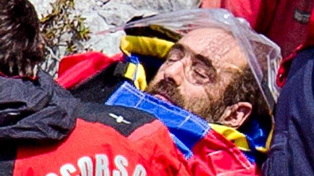Stretcher carrying injured caver brought to surface.