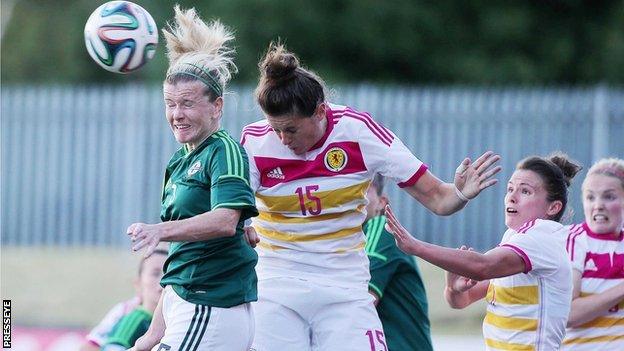 NI's Julie Nelson in aerial action against Scotland's Jennifer Beattie