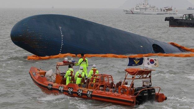 South Korean Coast Guard and rescue teams search for missing passengers at the site of the sunken ferry off the coast of Jindo Island on 17 April, 2014 in Jindo-gun, South Korea