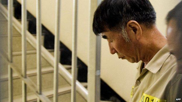 Sewol ferry captain Lee Joon-seok is escorted upon his arrival for his trial at the Gwangju District Court in the south-western South Korean city of Gwangju on 10 June, 2014