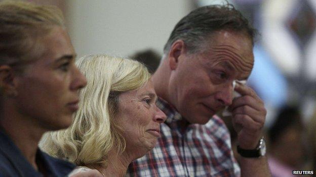 Hans Kremers (R) and his wife Roselie, parents of Kris Kremers, attend a service held for their missing daughter and her friend on Holy Thursday at a local church in Boquete town April 17