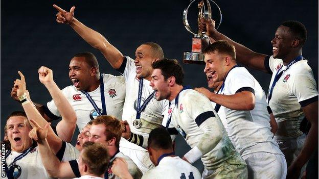 England captain Maro Itoje lifts the IRB World Junior Championship trophy as his team-mates celebrate with him