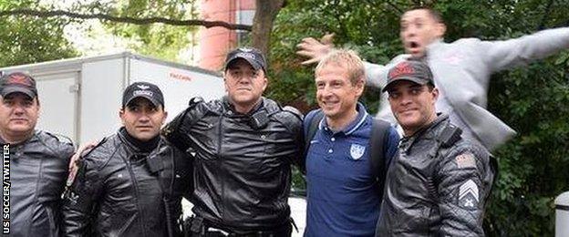 USA coach Jurgen Klinsmann, second from right, and striker Clint Dempsey (top)