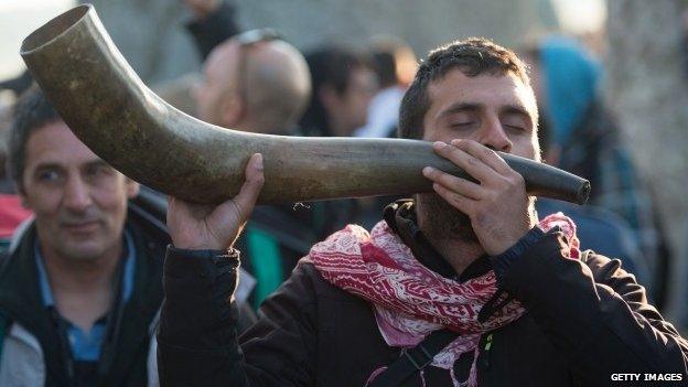 People take part in the summer solstice dawn celebrations