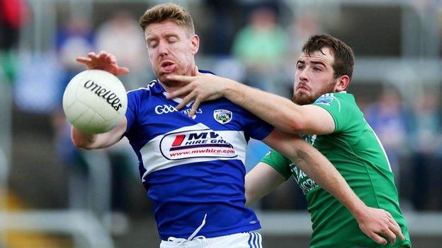 Denis Booth battles with Sean Quigley at O'Moore Park