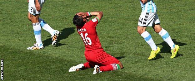 Iran's Reza Ghoochannejhad reacts after a missed chance against Argentina