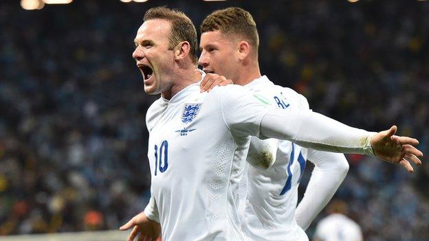 Wayne Rooney celebrates equalising against Uruguay with Ross Barkley