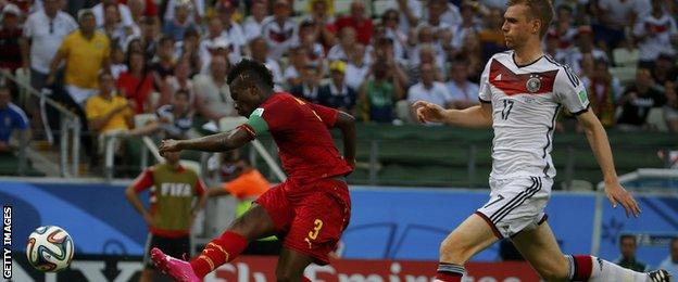 Ghana's Asamoah Gyan (left) scores against Germany