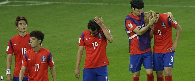 A dejected South Korea after being beaten by Algeria