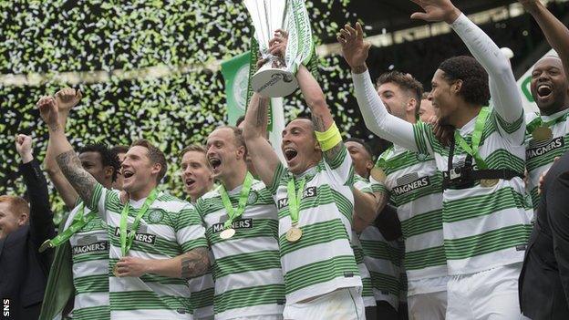 Celtic captain Scott Brown lifts the Scottish Premiership title